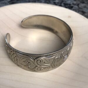 Signed embossed silver tone cuff